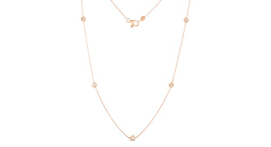 a rose gold delicate chain necklace with station, bezel set diamonds