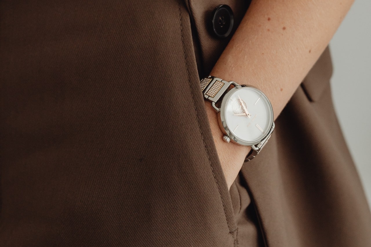 lady&rsquo;s hand in her pocket wearing a dress watch